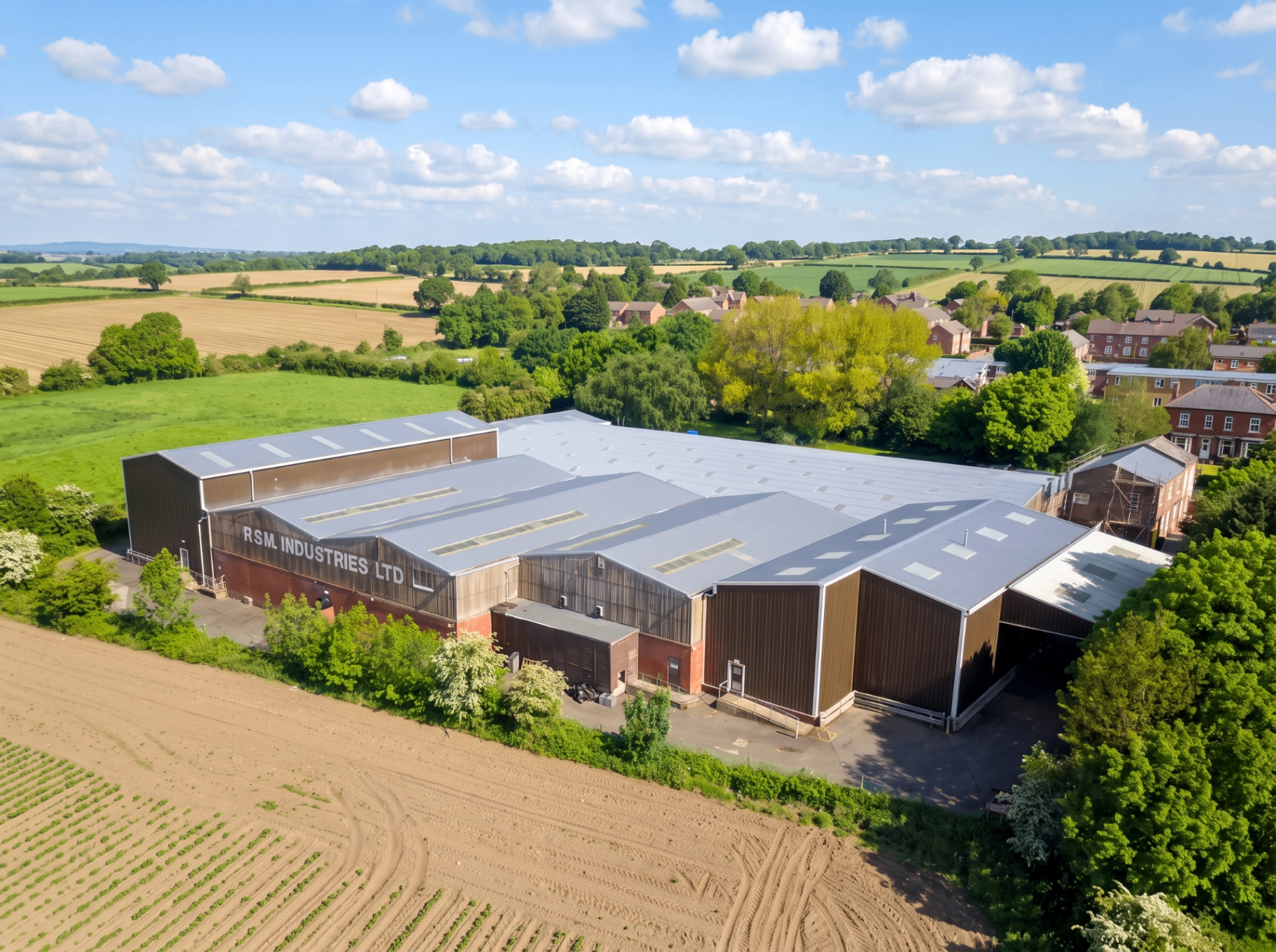 Aerial view of an industrial warehouse with a sealed ASL roof